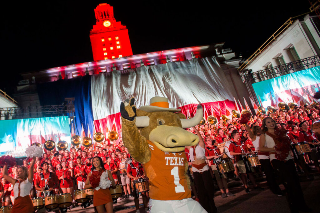 Gone to Texas. Hook 'Em mascot in front of the UT Band